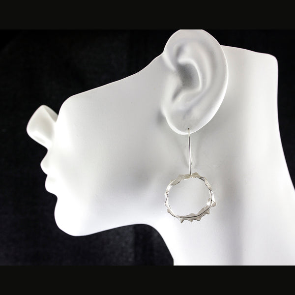 Silver leaf hoop earrings by eko jewelry design, Valeria on model