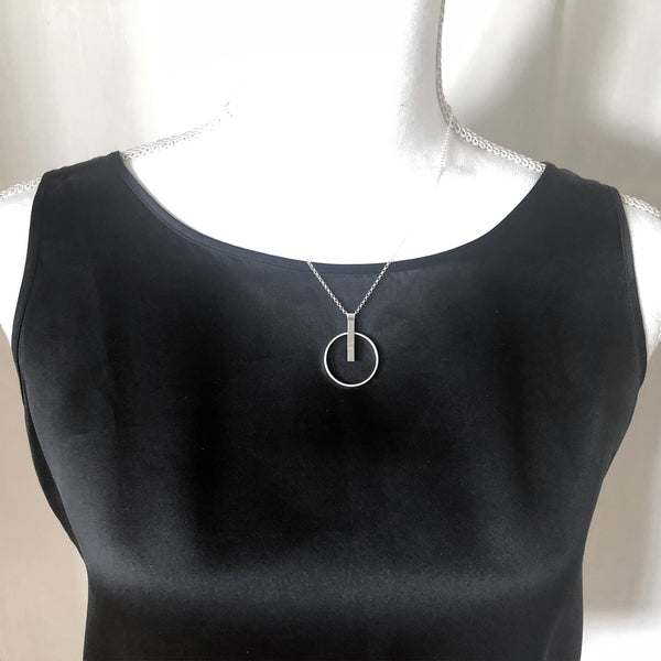 Silver hoop necklace with gemstone by eko jewelry design, Prudie on model
