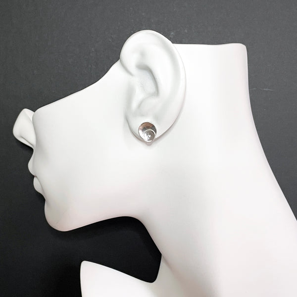 Round silver earrings with diamonds by eko jewelry design, Selima on model
