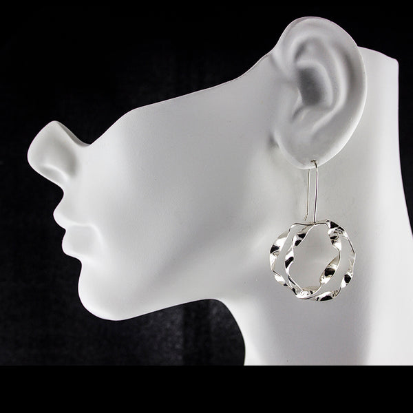 Large sterling silver double hoop earrings by eko jewelry design, Skylar on model