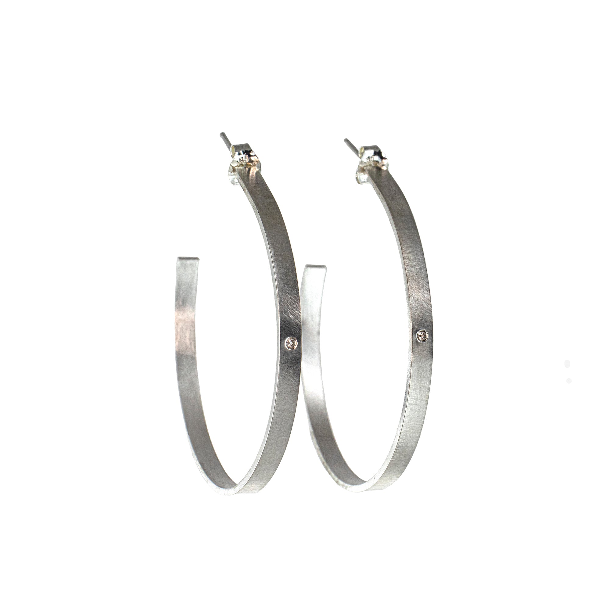Large silver hoop earrings with diamonds by eko jewelry