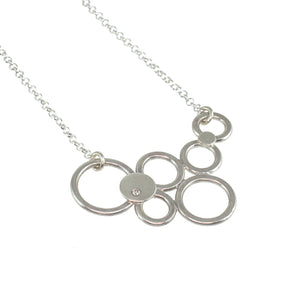 multi silver circle necklace with a diamond by eko jewelry design, Delicia