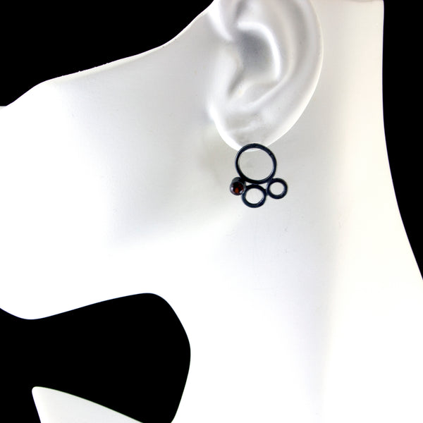 silver circle stud earrings with garnet by eko jewelry design, Zoe on model