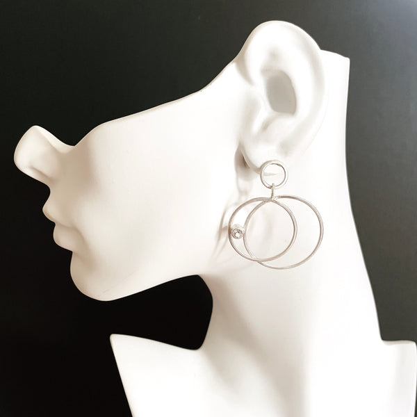 Silver double hoop earrings with gemstones by eko jewelry design, Amaris on model