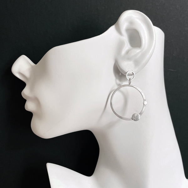 Silver hoop earrings with diamonds by eko jewelry design, Elara on model
