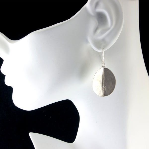 sterling silver leaf earrings by eko jewelry design, Daphne on model