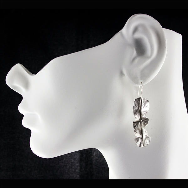 Sterling silver leaf earrings by eko jewelry design, Kiona on model