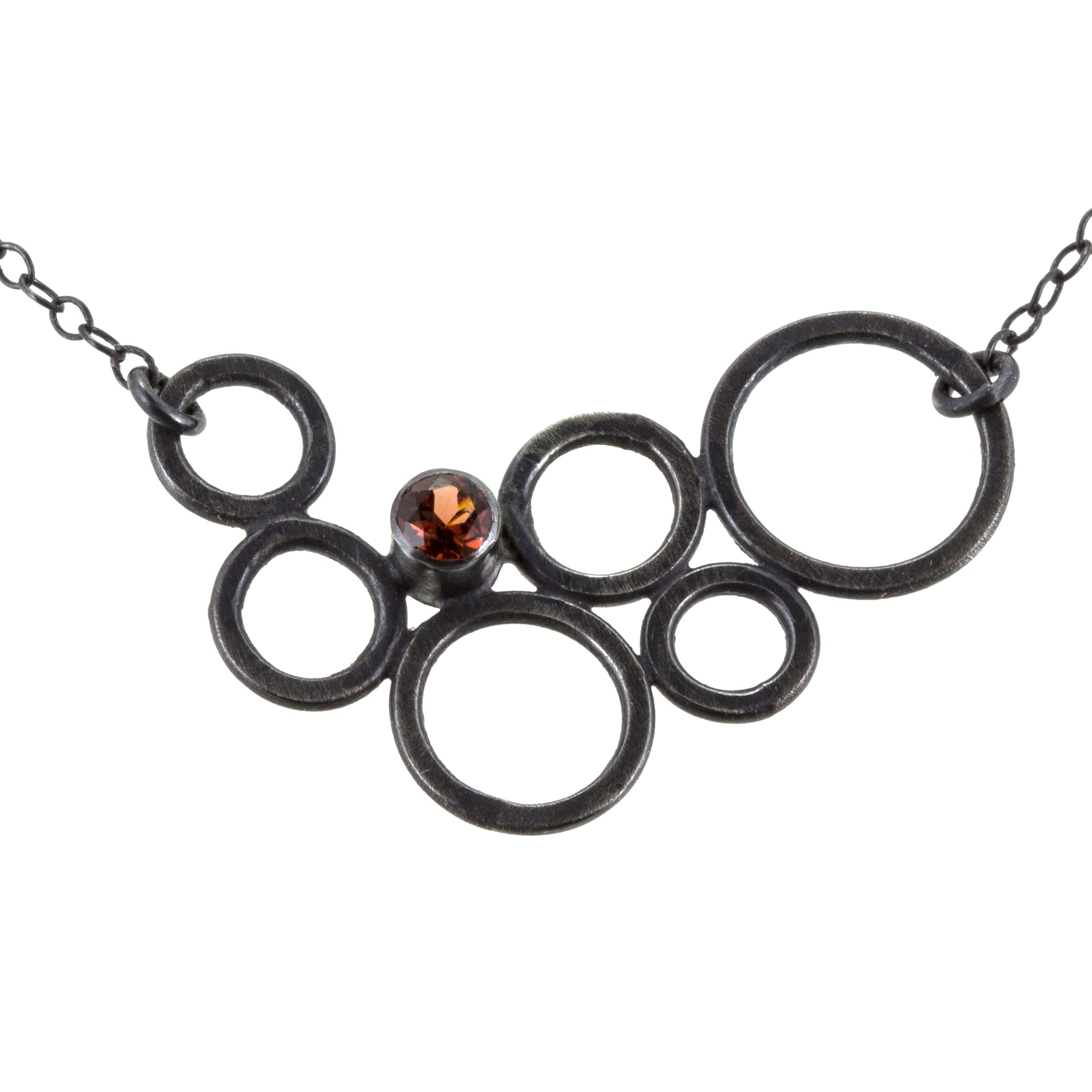 sterling silver circle necklace with garnet by eko jewelry design, Dawn