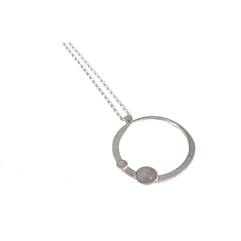 silver circle necklace with a gemstone by eko jewelry design, Thebe.