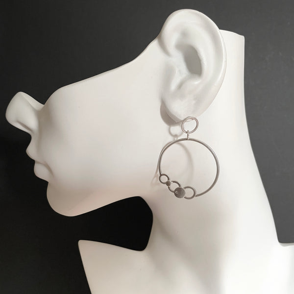 Silver hoop earrings with diamonds by eko jewelry design, Asta on model
