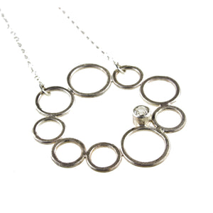 sterling silver circle necklace with a gemstone by eko jewelry design, Vespera