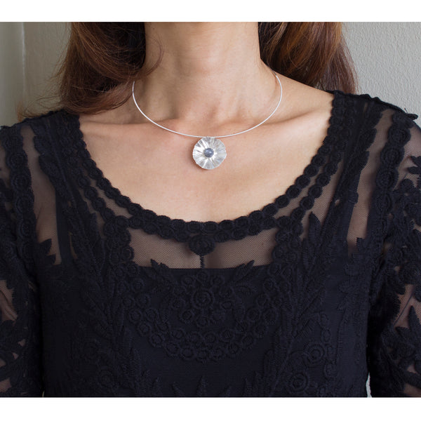 Sterling silver flower necklace with moonstone by eko jewelry design, Fiorella on model