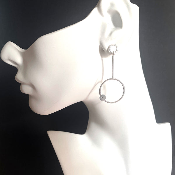 Silver hoop earrings with diamond by eko jewelry design, Dion on model